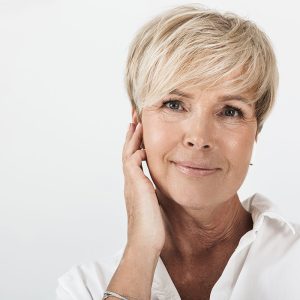 Smart Chip Hearing Aid_0000_portrait-closeup-beautiful-adult-woman-with-short-blond-hair-wearing-earpods-isolated-white-.jpg